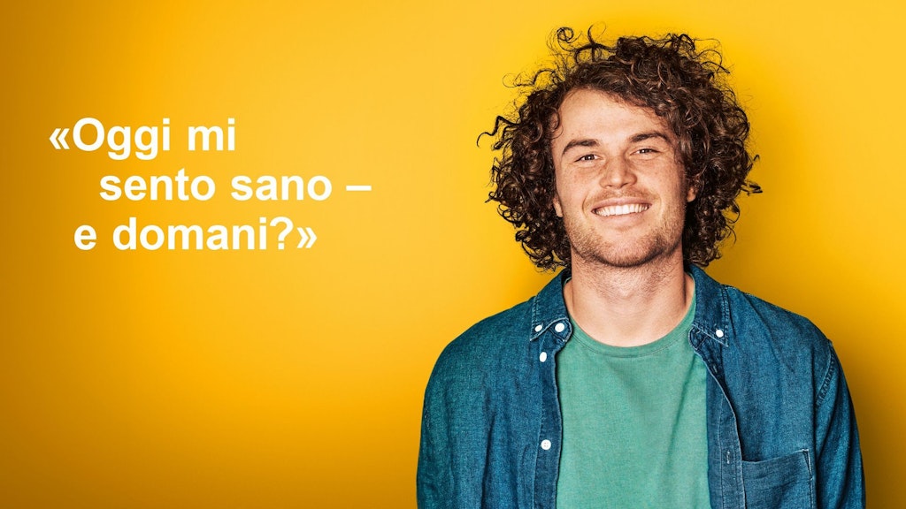 Giovane uomo dall'aria soddisfatta. Immagine accompagnata dalla citazione: “Oggi mi sento sano - e domani?”